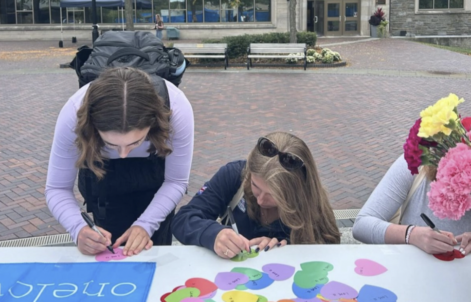 Students leave messages of support for victims of domestic violence.